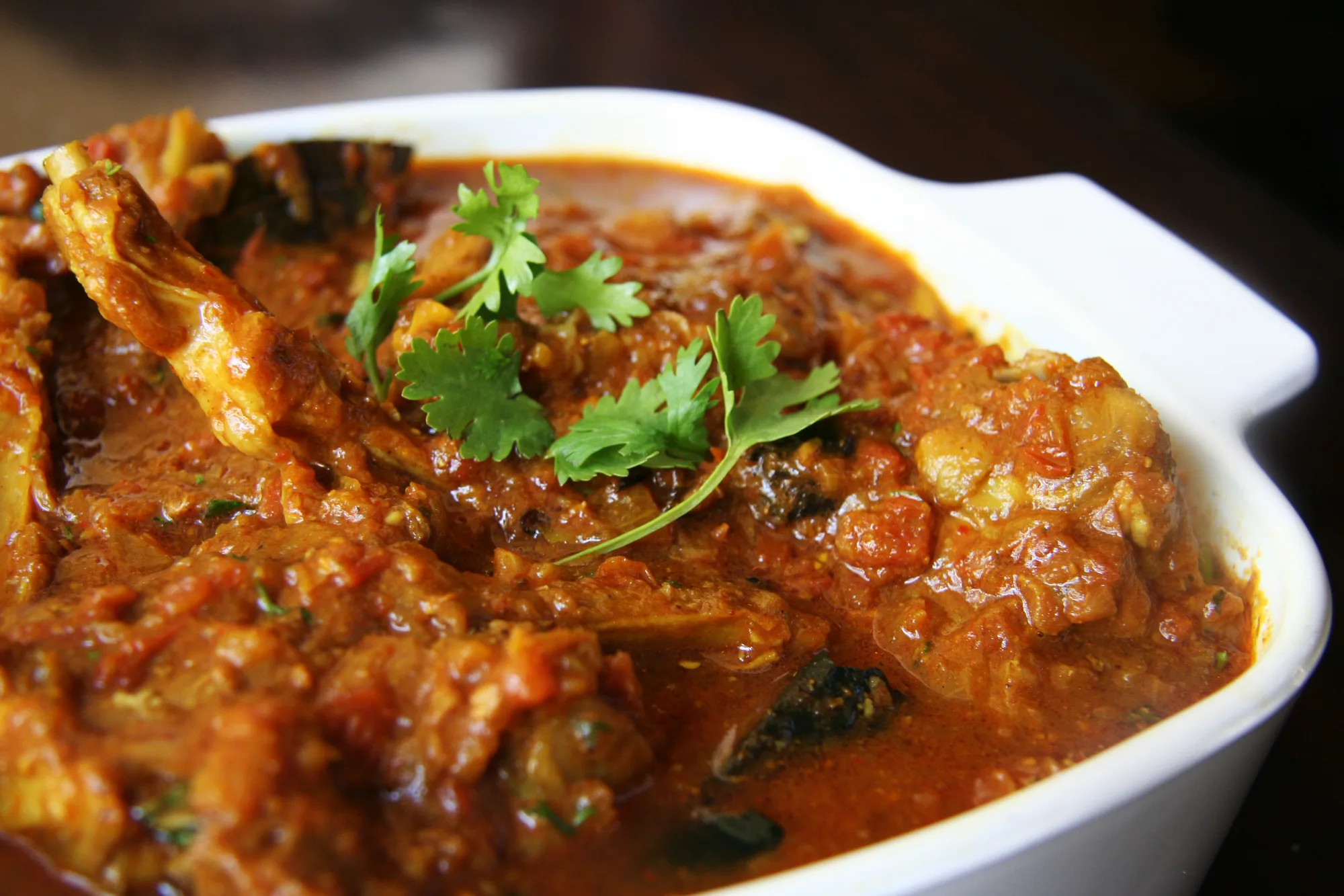A slow-cooked curry finished with fresh coriander